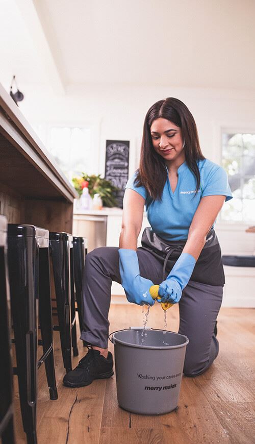 Merry Maid cleaning an apartment