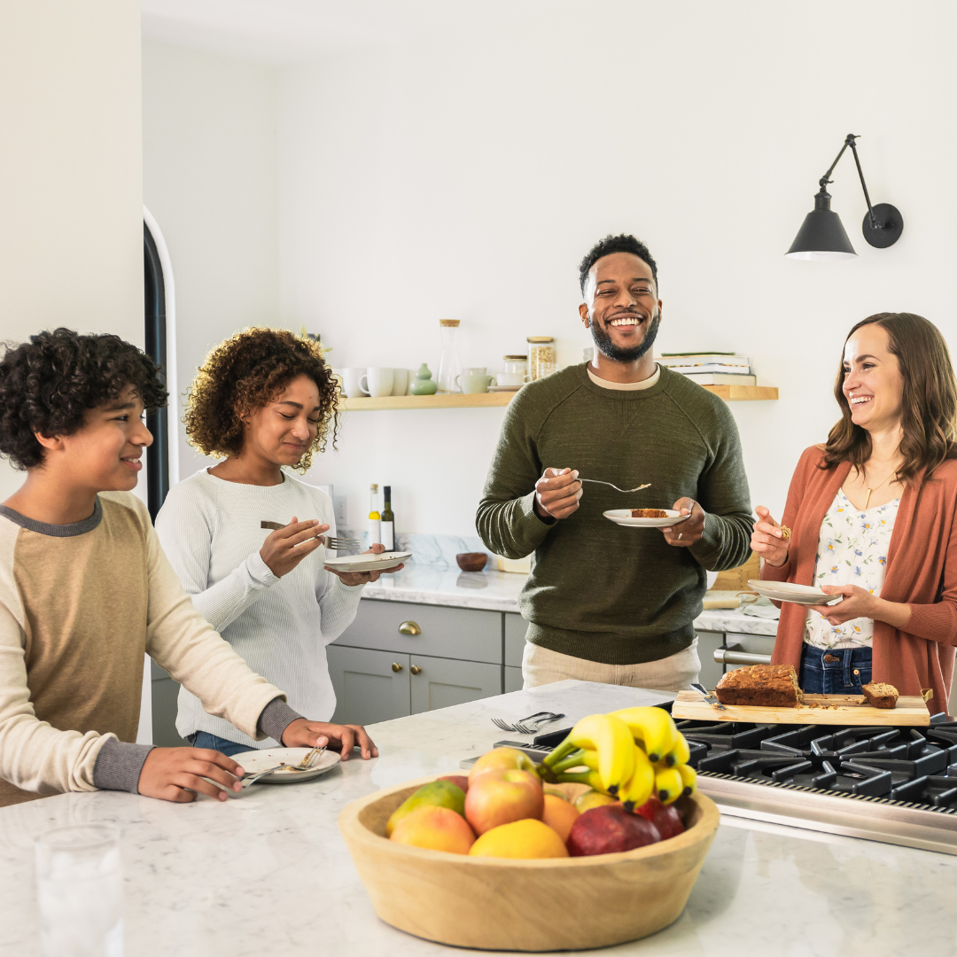 Family eating in clean kitchen after receiving house cleaning services